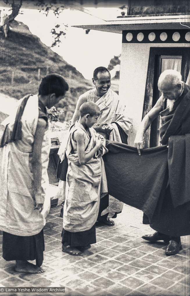 Zong Rinpoche shows Losang Tseten how to wear a zen, Kopan, 1974