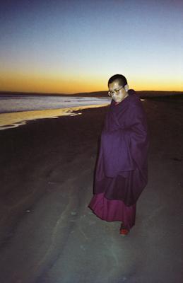 Lama Zopa Rinpoche at the beach, 1983