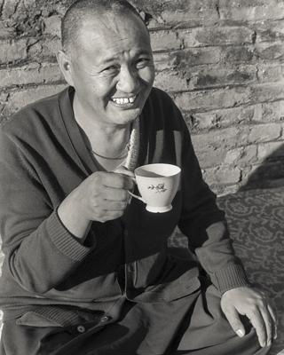 Lama having tea