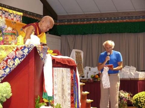 Nick Ribush delivering a request for Lama Zopa Rinpoche's long life at Light of the Path retreat 2016. Photo: Kalleen Mortensen.
