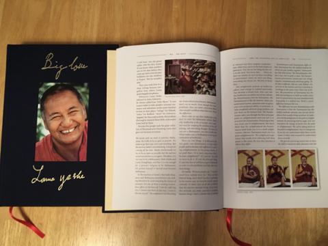 The 2 volume set of Big Love: The Life and Teachings of Lama Yeshe, by Adele Hulse, featuring the cover of volume 1, and volume 2 opened to show pages.