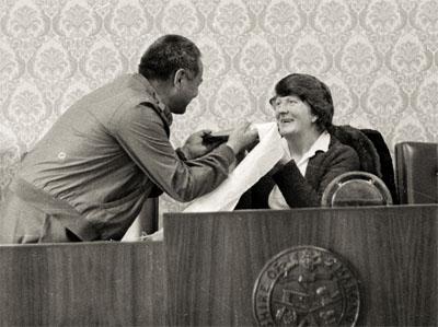 Lama Yeshe presents book and khata to Elaine McNamara, president of Marong shire, Victoria, Australia, 1981.