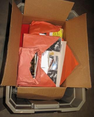 A box of items donated for the Lama Yeshe Wisdom Archive image collection.