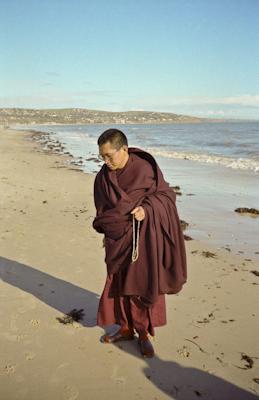 Lama Zopa Rinpoche at the beach, 1983